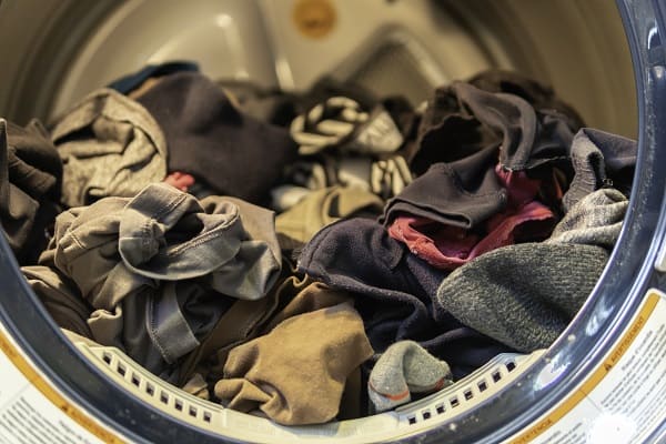 Why Do Clothes Smell After Drying: Solutions Guide